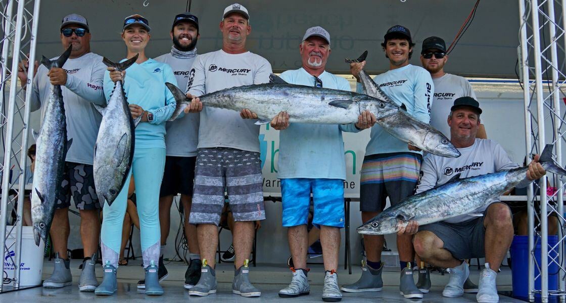 fishermen showing off catches